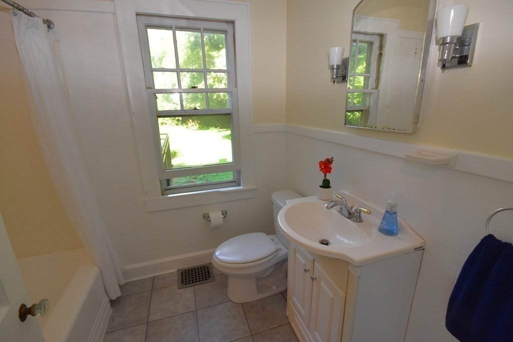 236 Harkness Road Amherst, MA 01002 - Photo 23 of 41 a bathroom with a sink toilet and a window