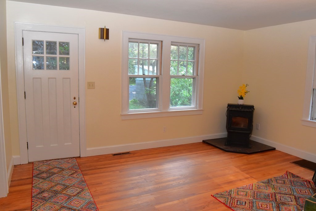 236 Harkness Road Amherst, MA 01002 - Photo 7 of 41 an empty room with wooden floor and windows