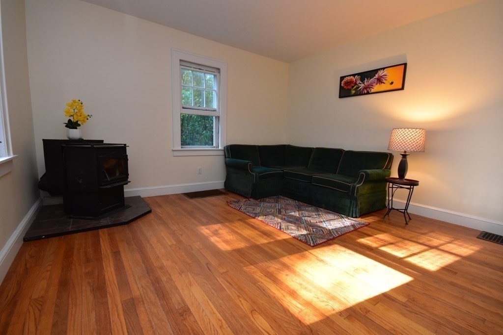 236 Harkness Road Amherst, MA 01002 - Photo 10 of 41 a bedroom with a bed and wooden floor