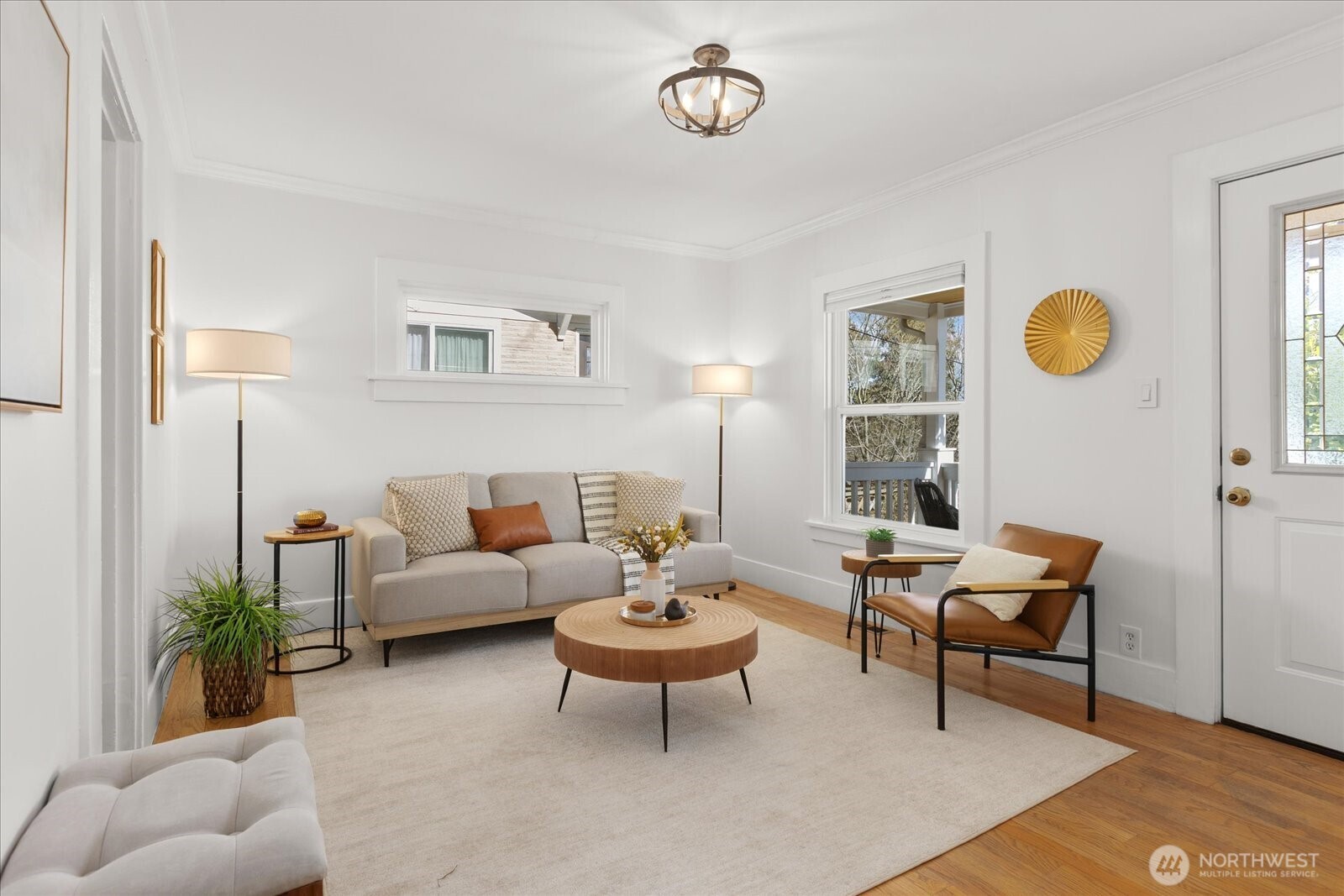7729 18th Avenue Southwest Seattle, WA 98106 - Photo 12 of 36 a living room with furniture a lamp and a table