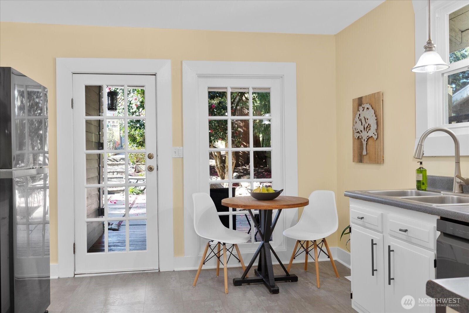 7729 18th Avenue Southwest Seattle, WA 98106 - Photo 16 of 36 a view of a dining room with furniture and window