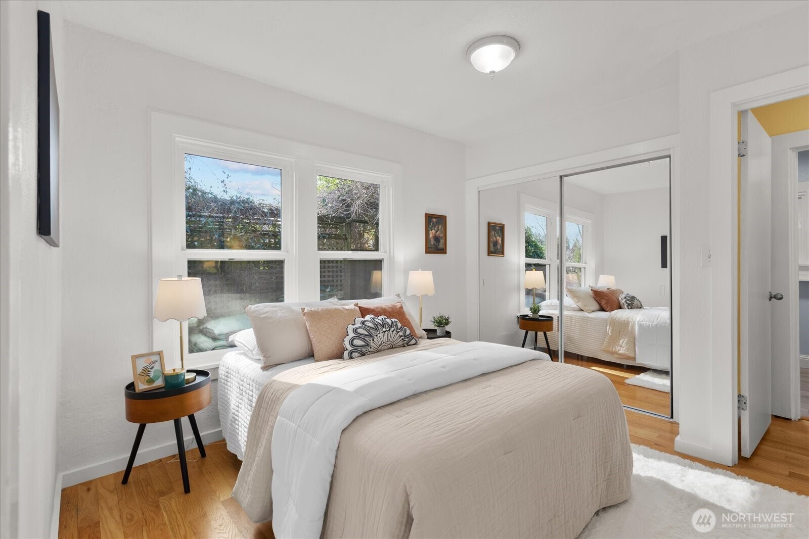 7729 18th Avenue Southwest Seattle, WA 98106 - Photo 24 of 36 a bedroom with a bed and a large window