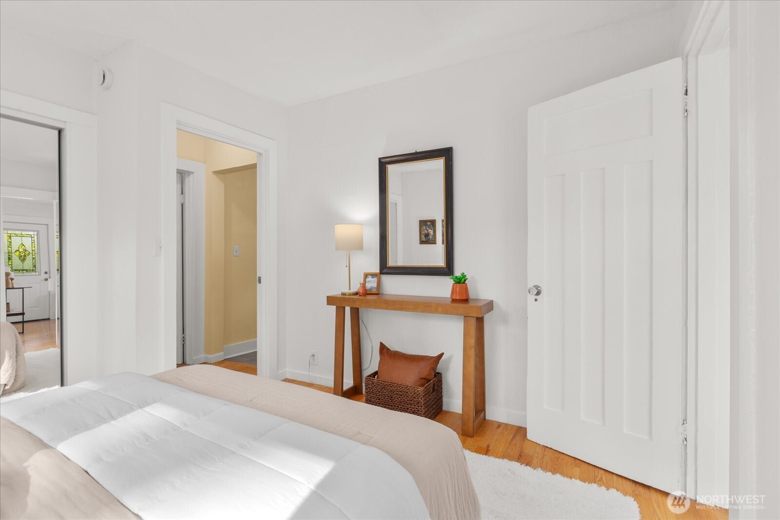 7729 18th Avenue Southwest Seattle, WA 98106 - Photo 25 of 36 a bedroom with a bed and a mirror