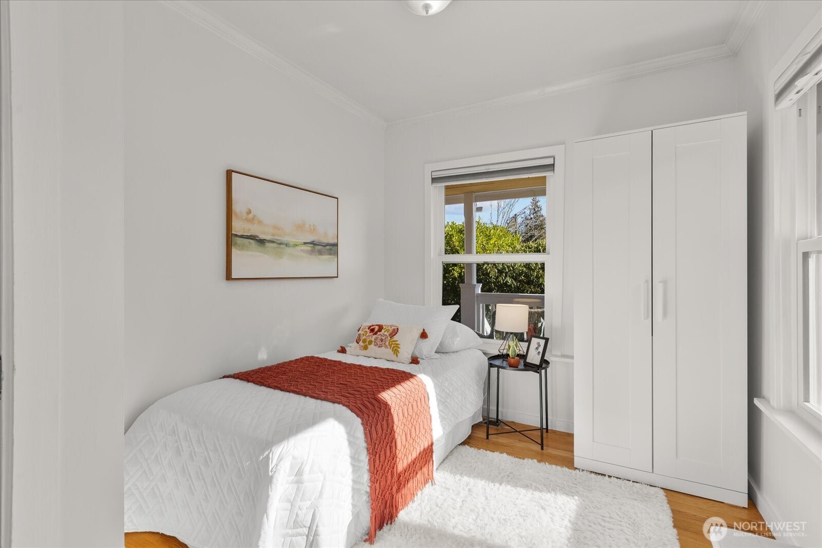 7729 18th Avenue Southwest Seattle, WA 98106 - Photo 26 of 36 a bedroom with a bed and a window