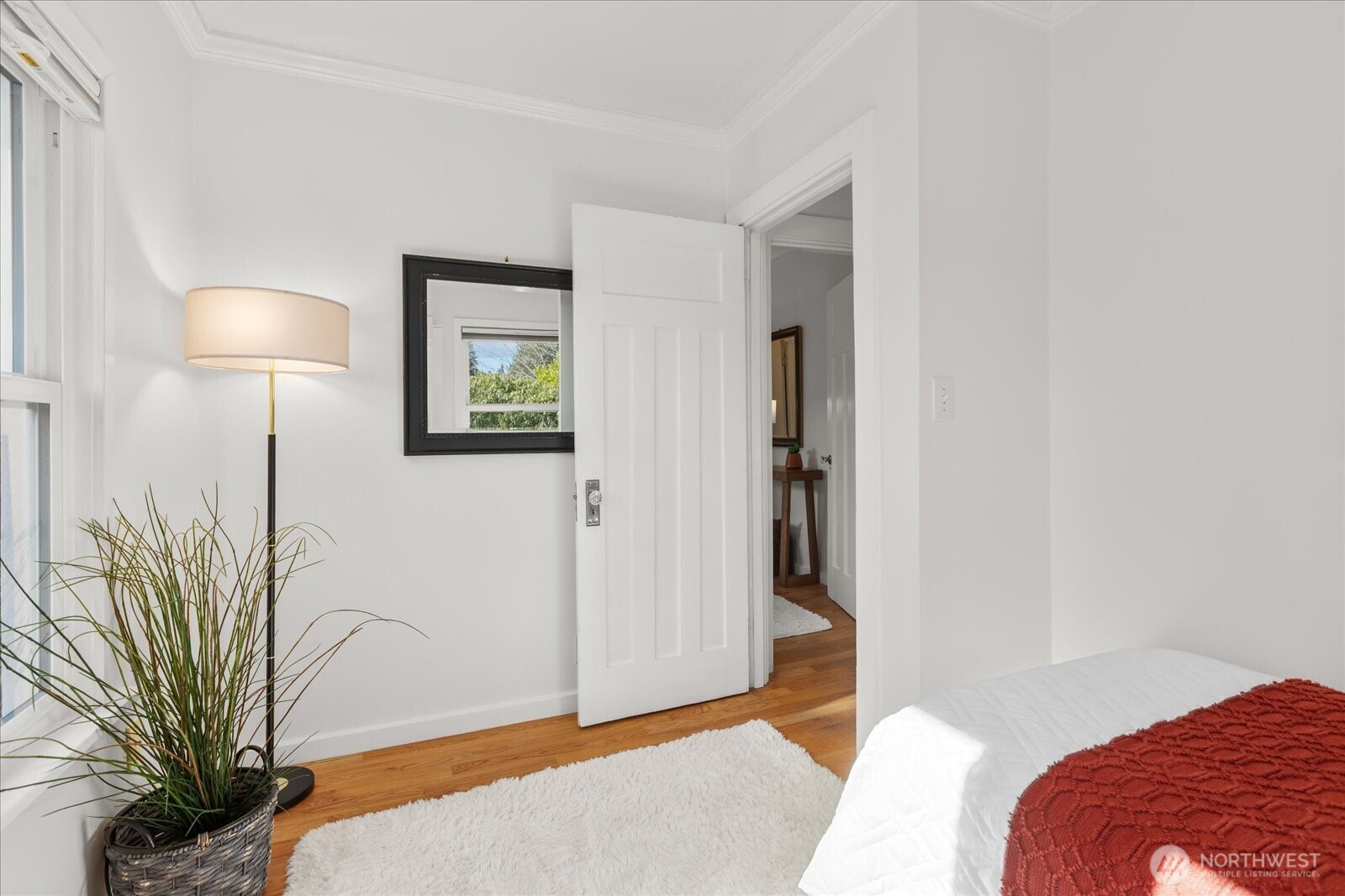 7729 18th Avenue Southwest Seattle, WA 98106 - Photo 27 of 36 a bedroom with a bed and a lamp