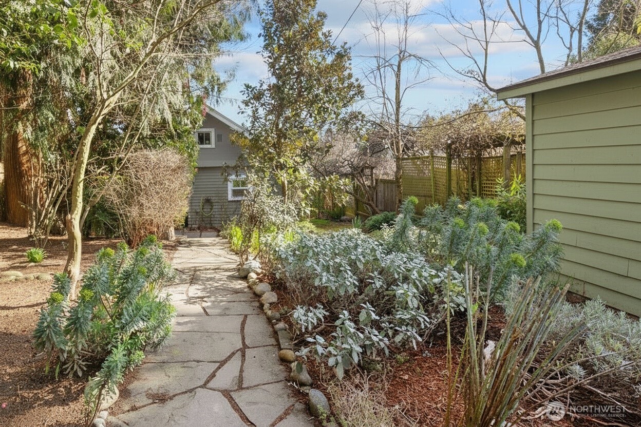 7729 18th Avenue Southwest Seattle, WA 98106 - Photo 34 of 36 a view of a pathway of a house with a tree