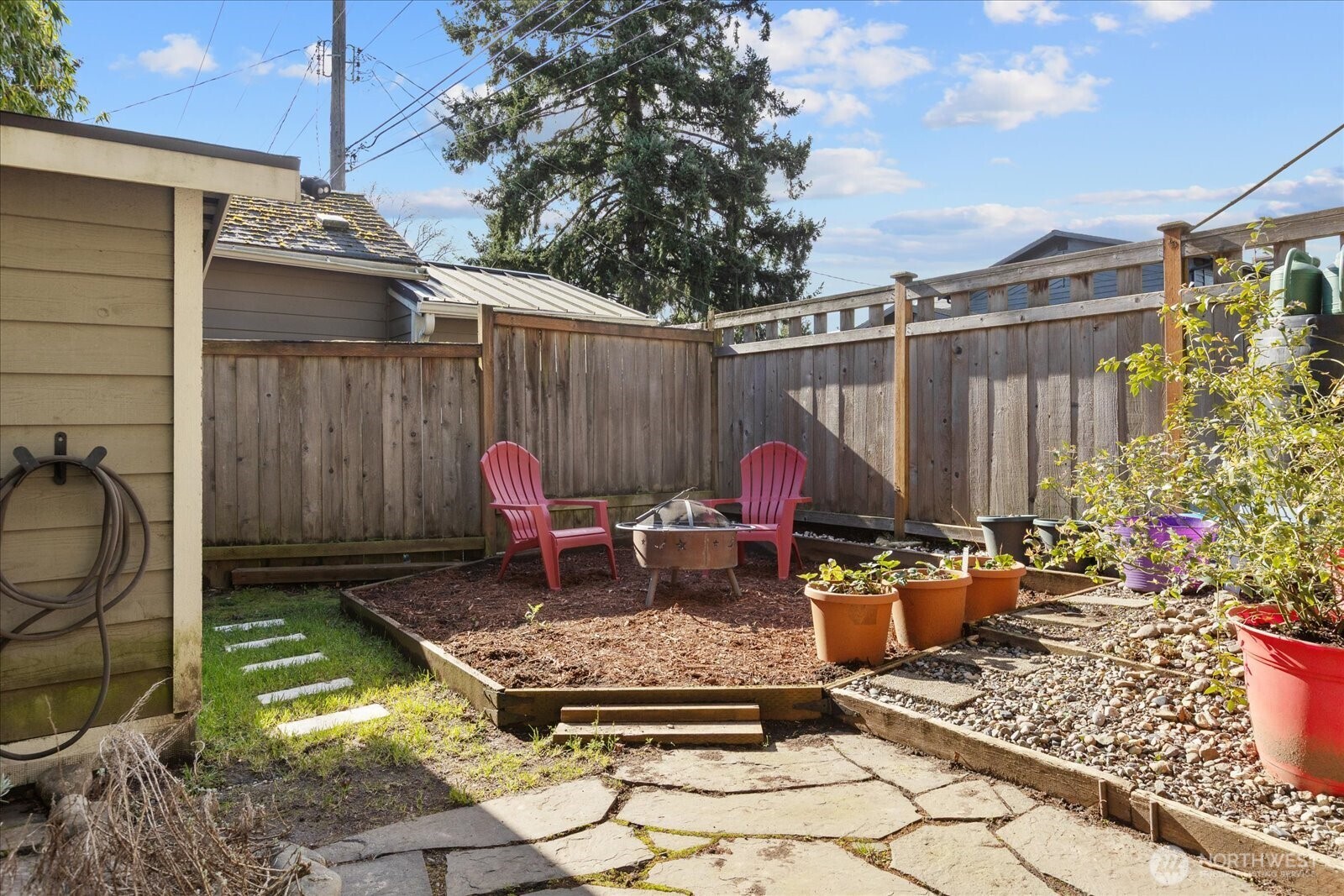 7729 18th Avenue Southwest Seattle, WA 98106 - Photo 35 of 36 a view of a dinning tables and chairs in backyard