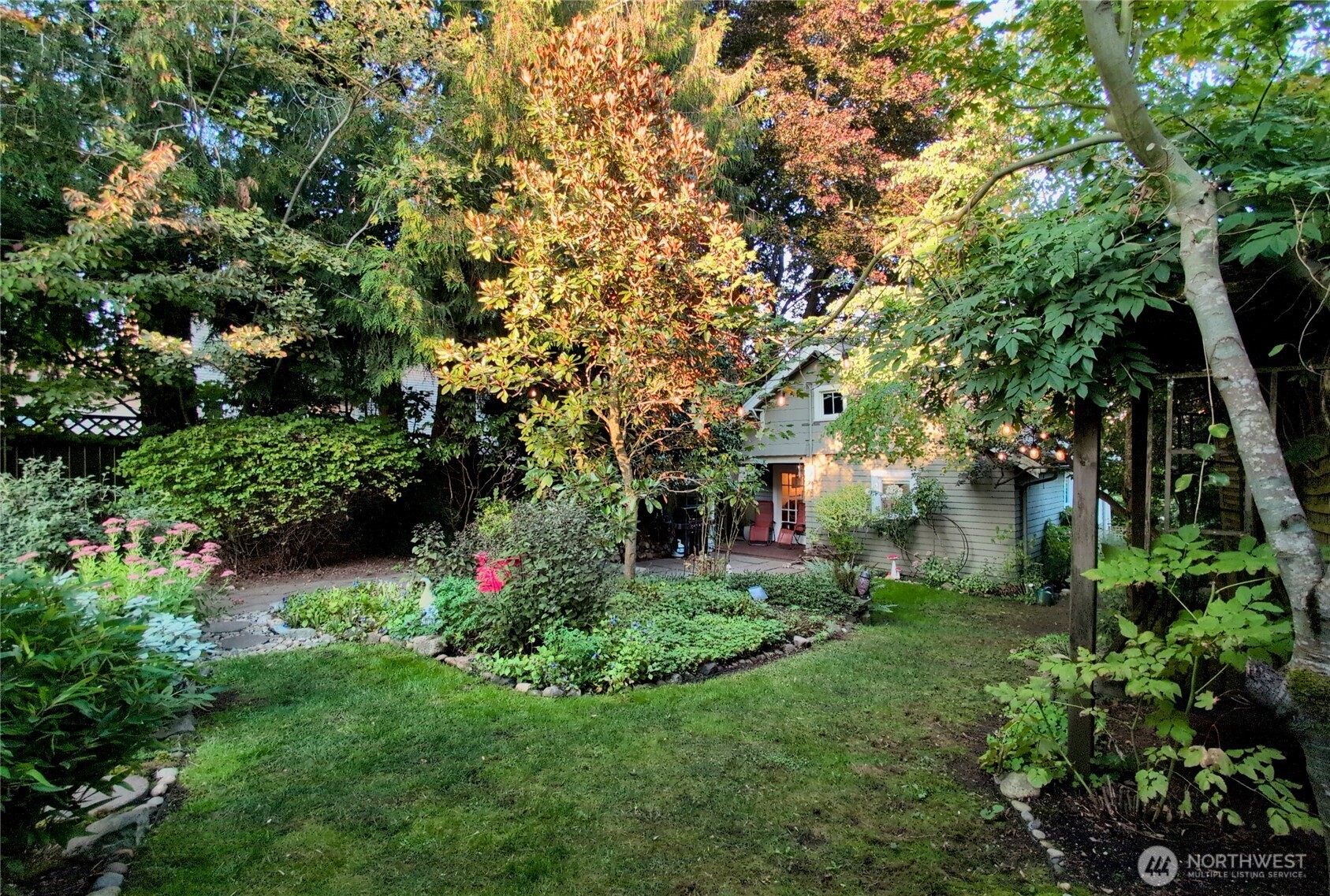 7729 18th Avenue Southwest Seattle, WA 98106 - Photo 36 of 36 a view of a garden with large trees