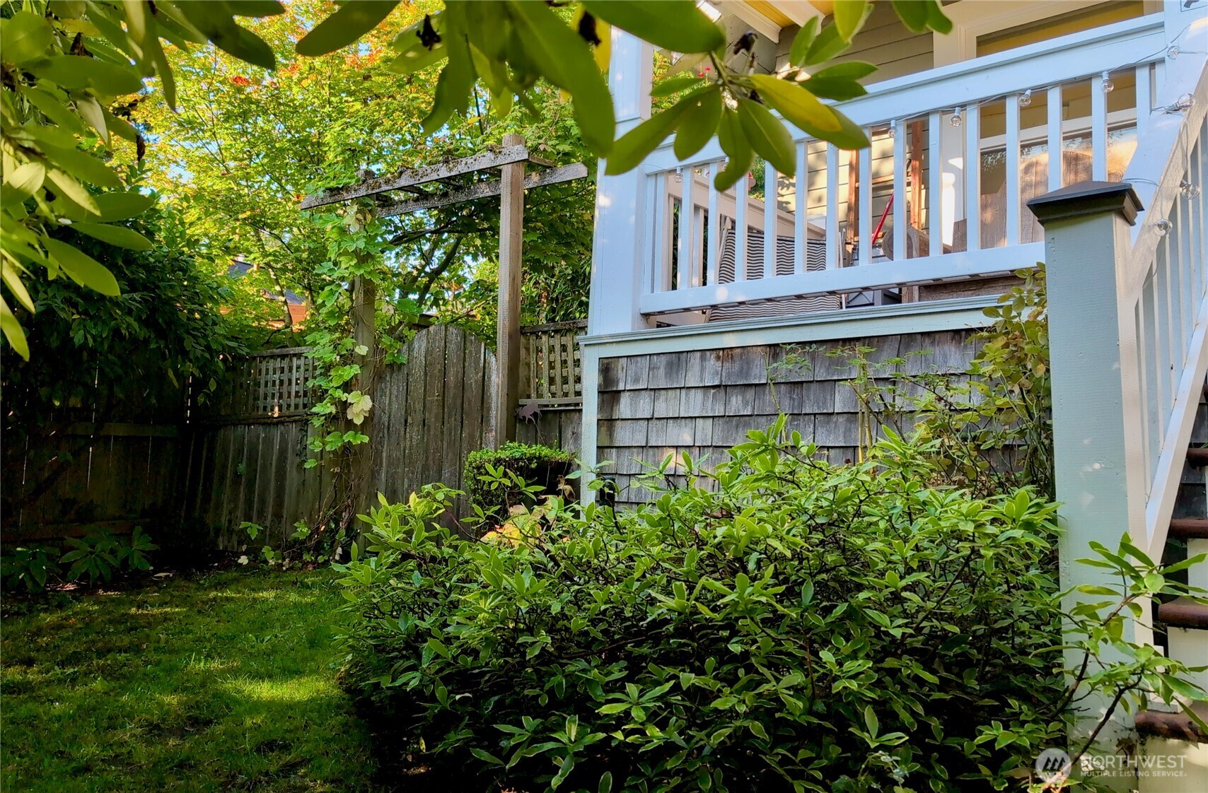 7729 18th Avenue Southwest Seattle, WA 98106 - Photo 5 of 36 a view of a house with a yard and plants