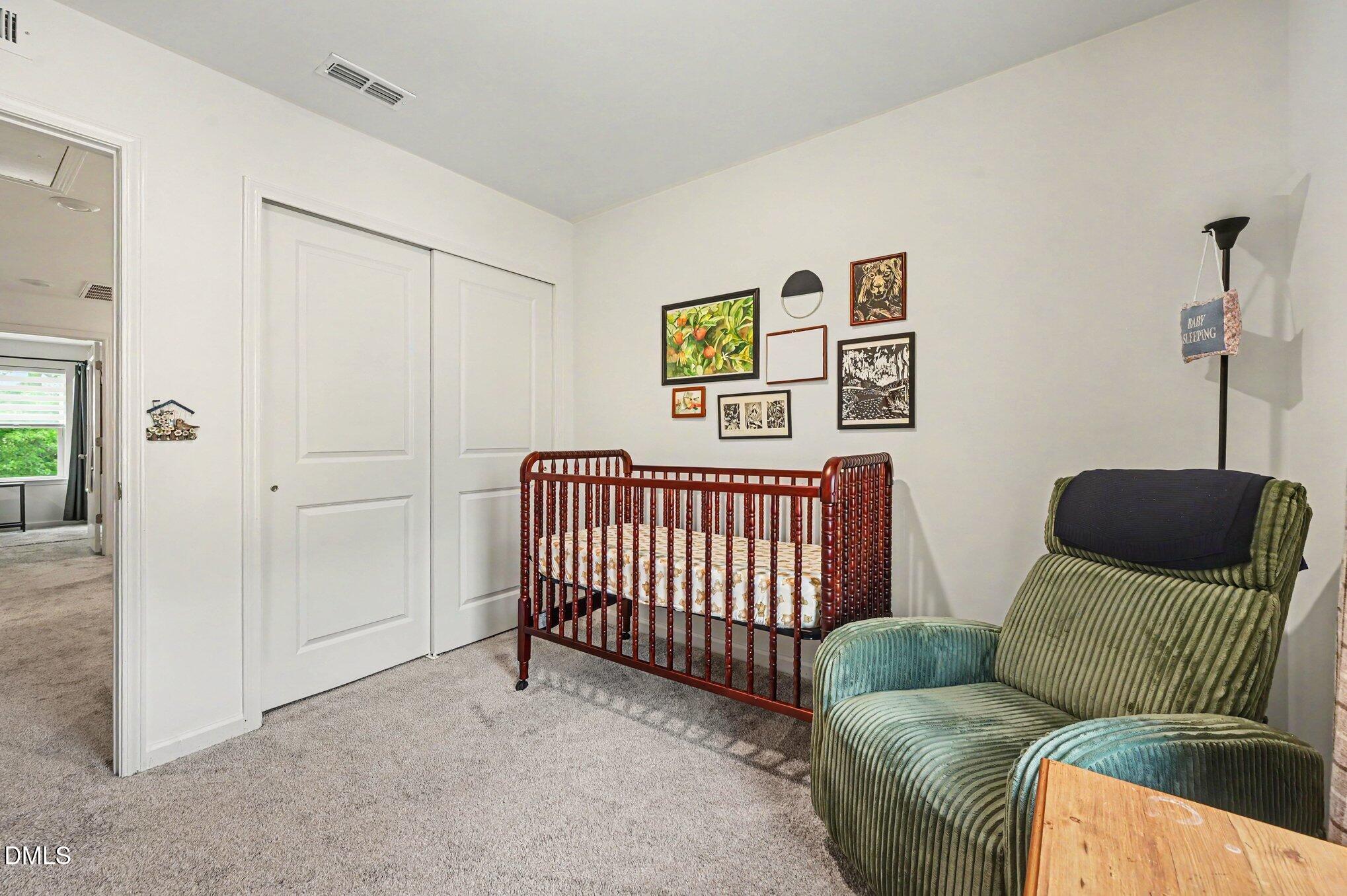 574 Hacksaw Trail Raleigh, NC 27610 - Photo 16 of 28 a bedroom with a couch and a window