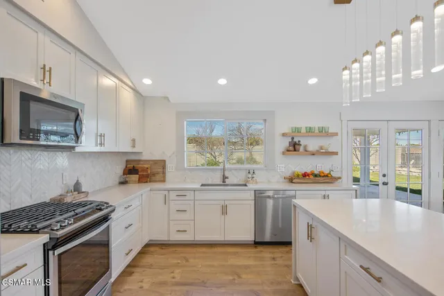 a bathroom with a sink and a large window