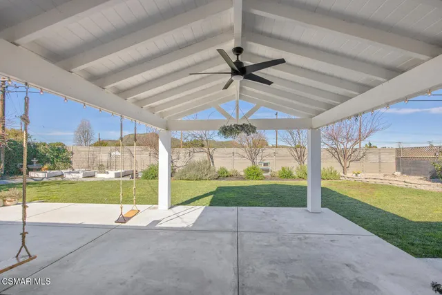 a view of a patio with a yard