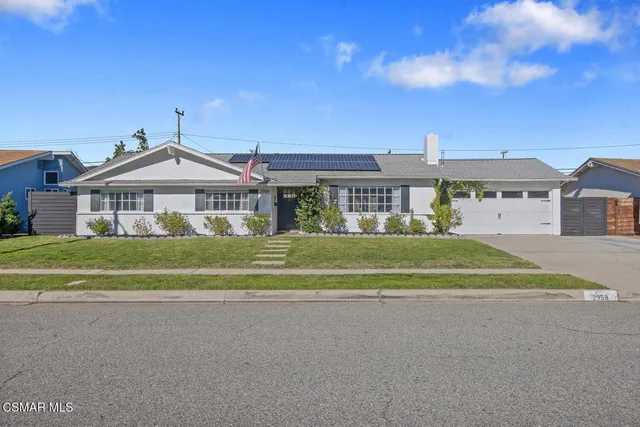 a front view of a house with a ocean view