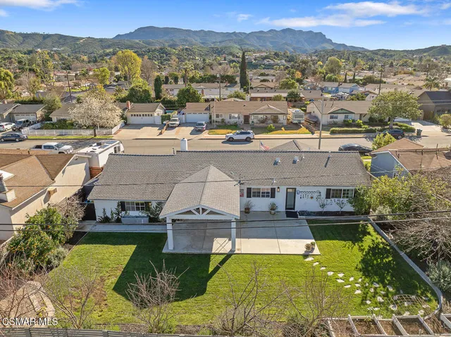 an aerial view of a house with a swimming pool