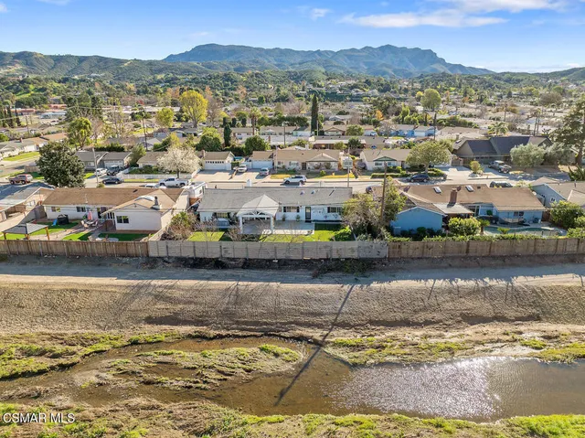 a view of a ocean with a building in the background