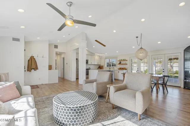 a view of a dining room with furniture wooden floor and chandelier