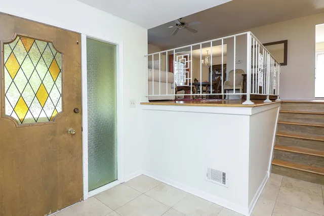 a view of living room with furniture and window