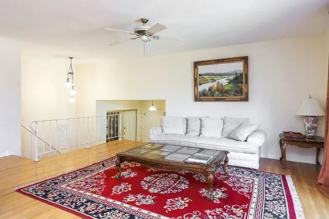 a living room with furniture and a rug