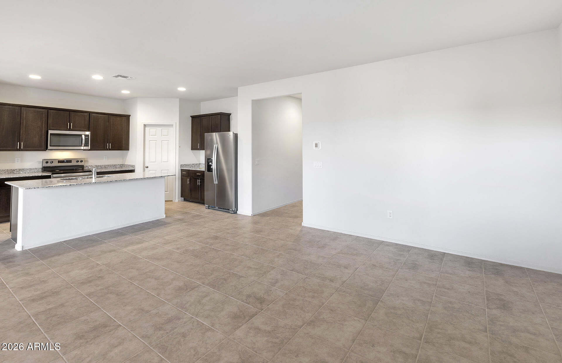 25446 West Romley Road Buckeye, AZ 85326 - Photo 6 of 21 4 - Kitchen and Gathering Area