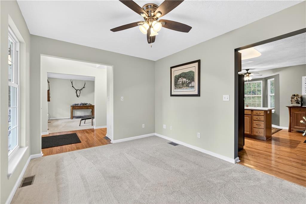 139 Ladybug Lane Ligonier, PA 15658 - Photo 15 of 33 a view of a hallway with a livingroom and a chandelier fan