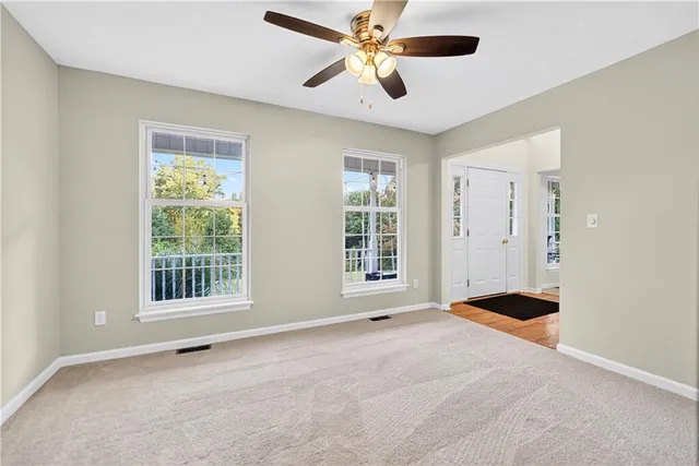 a view of an empty room with a window