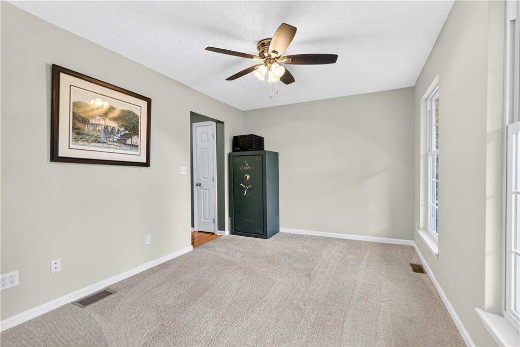 139 Ladybug Lane Ligonier, PA 15658 - Photo 17 of 33 a view of a livingroom with a ceiling fan and window
