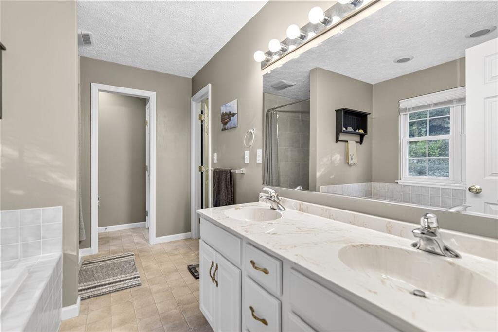 139 Ladybug Lane Ligonier, PA 15658 - Photo 22 of 33 a bathroom with a sink double vanity and a mirror