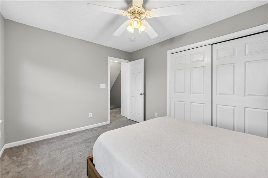 139 Ladybug Lane Ligonier, PA 15658 - Photo 26 of 33 a bedroom with a bed and a chandelier