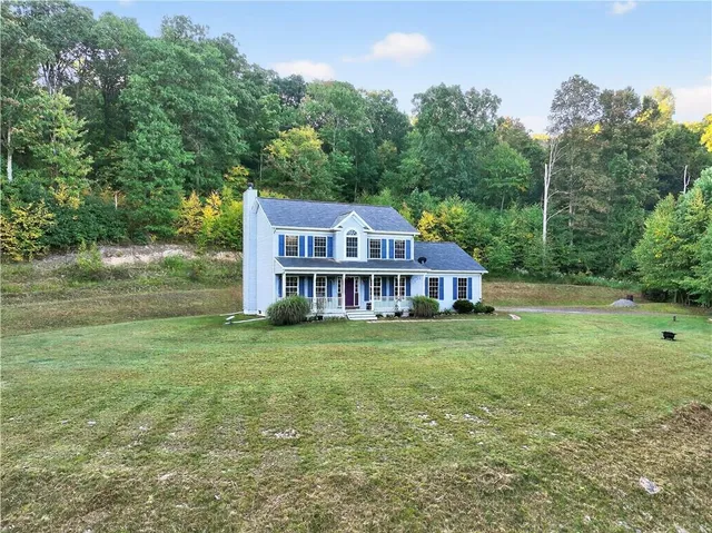 a view of a house with a big yard