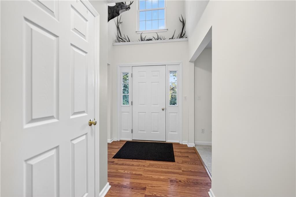 139 Ladybug Lane Ligonier, PA 15658 - Photo 5 of 33 a view of a hallway with a dining room and stairs