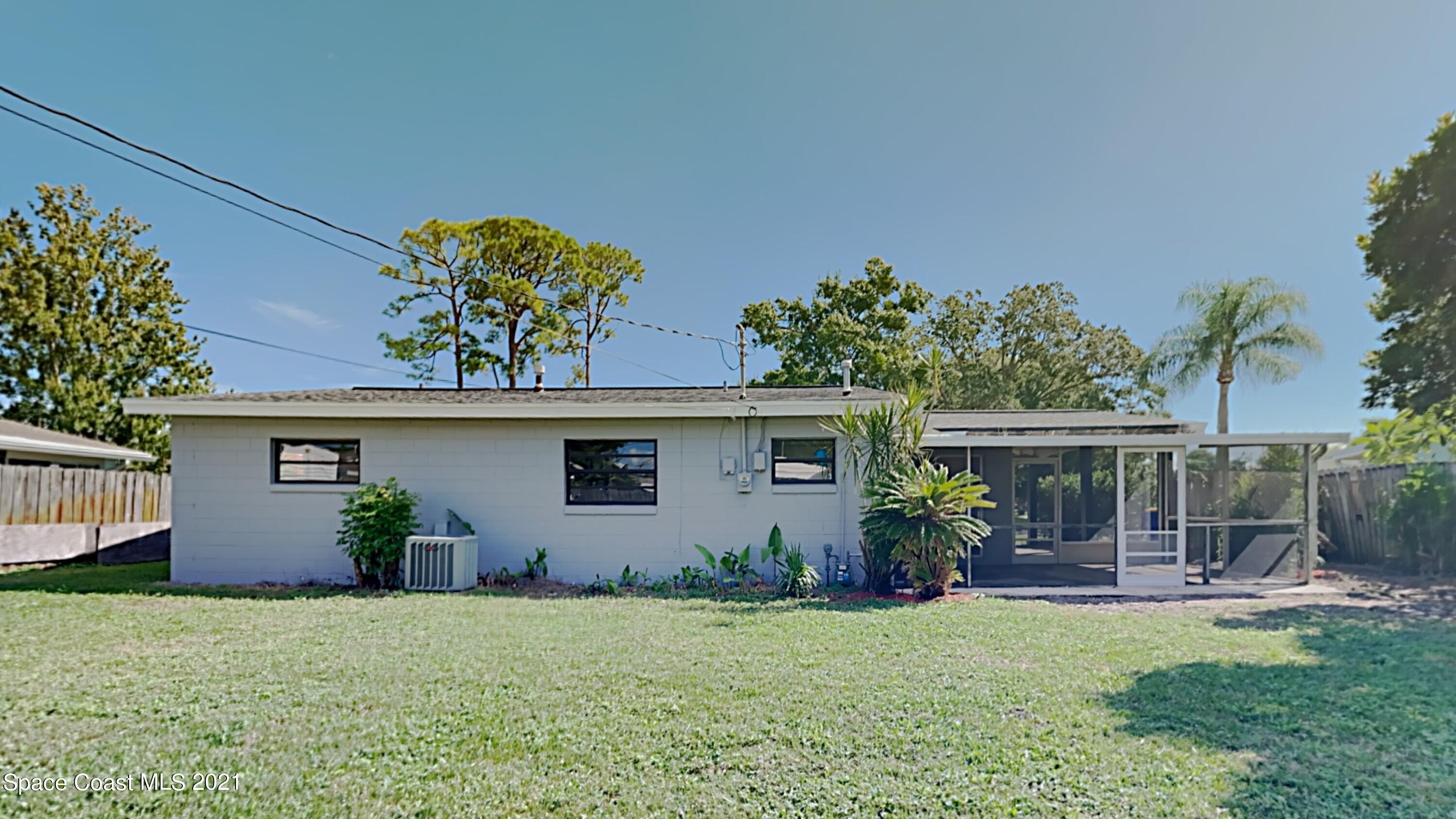 955 Lexington Road Rockledge, FL 32955 - Photo 17 of 18 front view of house with a yard