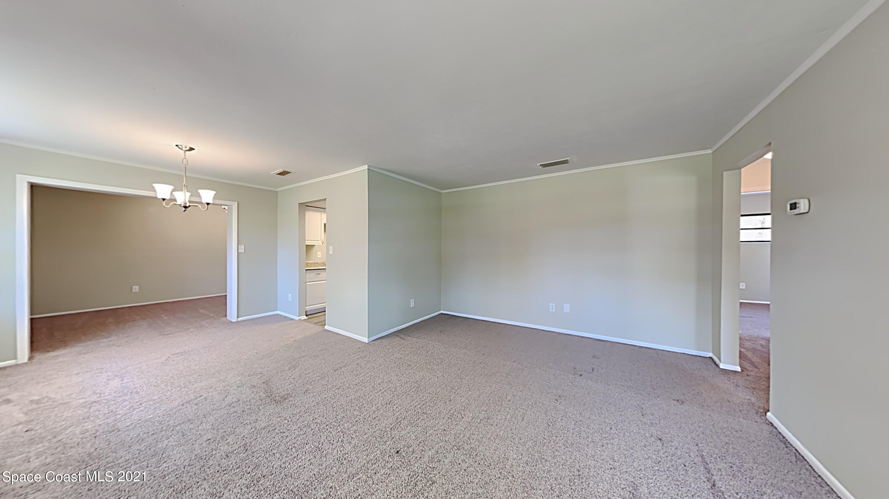 955 Lexington Road Rockledge, FL 32955 - Photo 4 of 18 a view of an empty room
