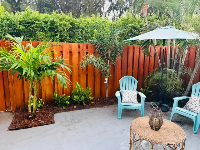 a view of a livingroom with a ceiling fan and window