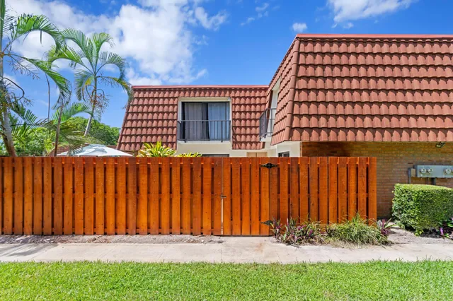 a backyard of a house with a yard and garage