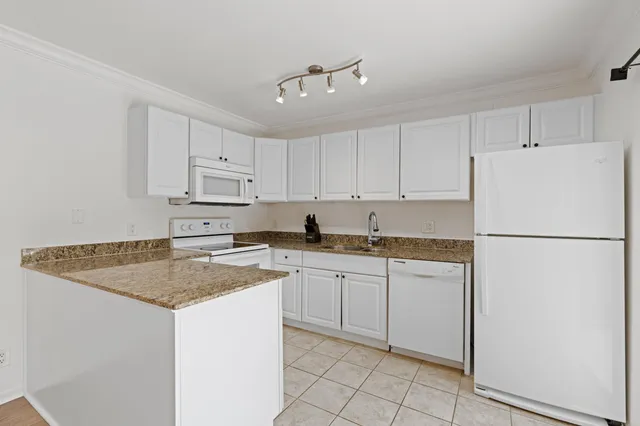 a view of a chandelier fan in a room
