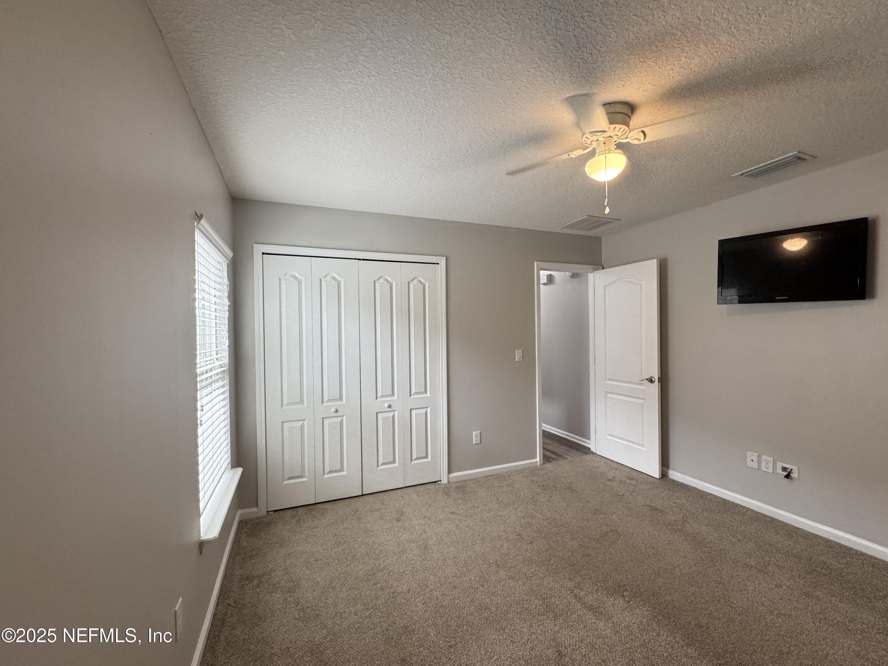 94267 Woodbrier Circle Fernandina Beach, FL 32034 - Photo 11 of 32 a view of a livingroom with a flat screen tv