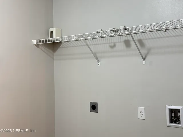 a view of a room with a large window