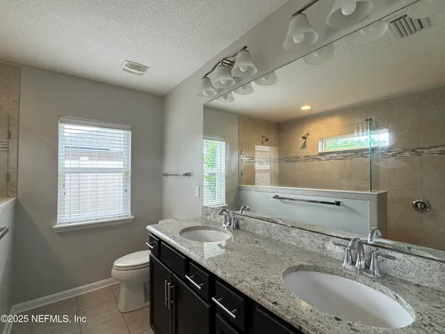 a view of a utility room with a cabinet