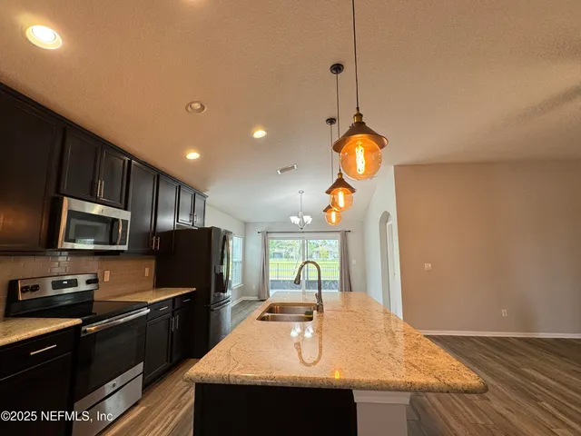 a view of a livingroom with a flat screen tv