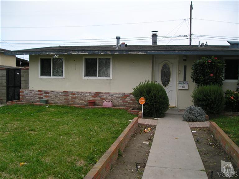 4900 Saviers Road Oxnard, CA 93033 - Photo 2 of 14 a front view of a house with garden