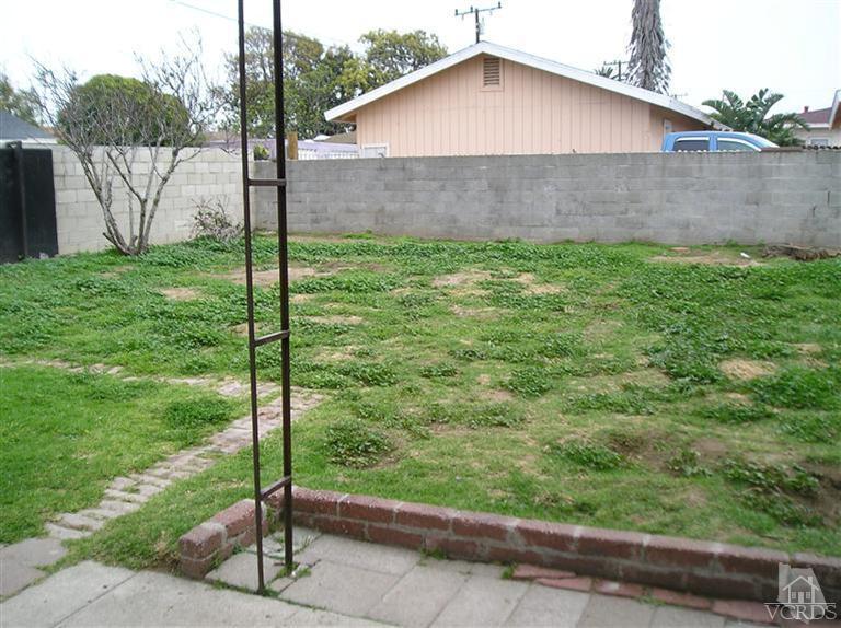 4900 Saviers Road Oxnard, CA 93033 - Photo 11 of 14 a backyard of a house with a garden and plants