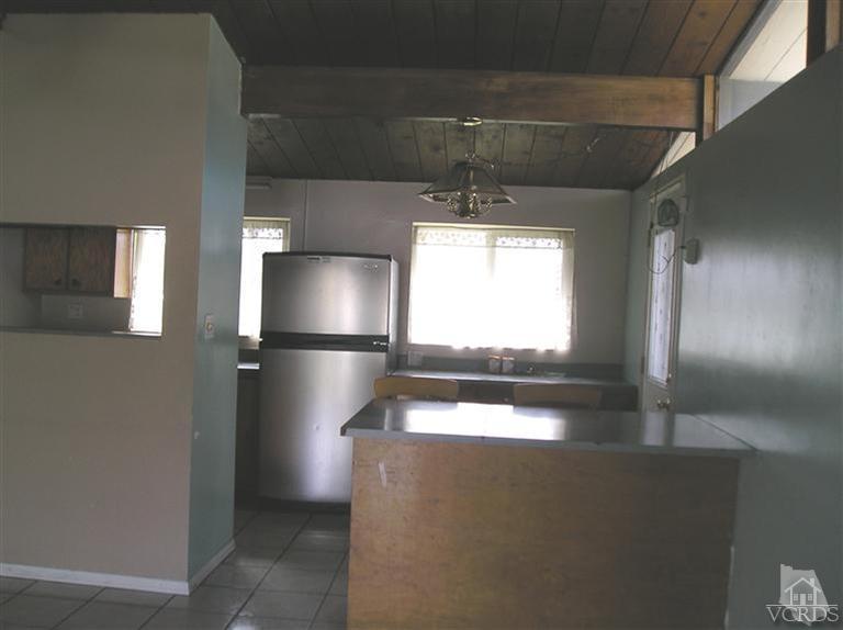4900 Saviers Road Oxnard, CA 93033 - Photo 6 of 14 a view of a room with a refrigerator