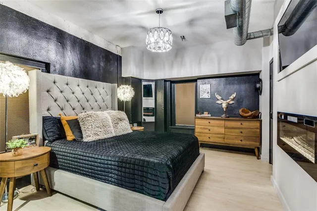 a bedroom with a bed and a mirror