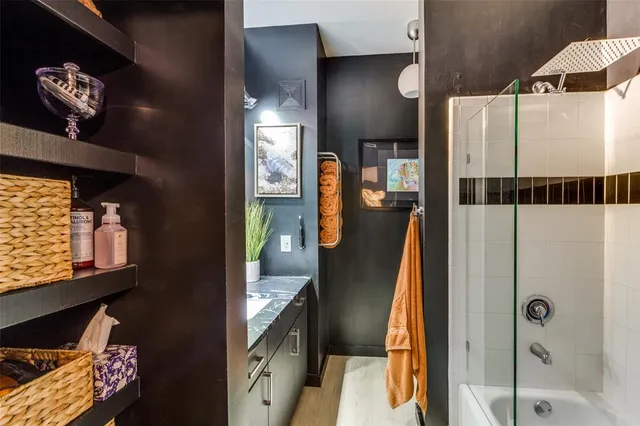 a bathroom with a sink double vanity and a mirror