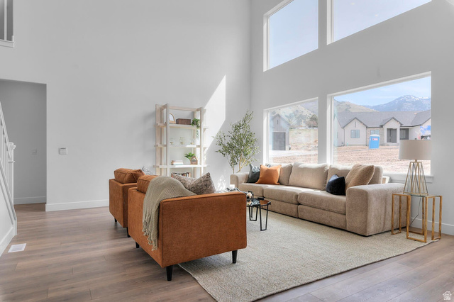 342 North Rhyolite Drive, Unit 88 Hurricane, UT 84737 - Photo 5 of 26 Living room with wood-finish flooring and white baseboards