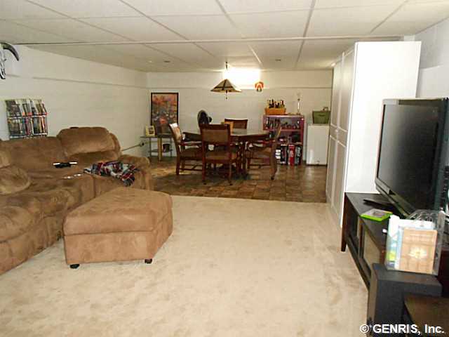 560 Helendale Road Irondequoit, NY 14609 - Photo 11 of 19 Rec room. The recreation room, in the basement, fi