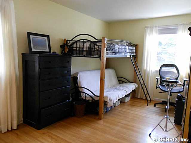 560 Helendale Road Irondequoit, NY 14609 - Photo 15 of 19 Bedroom. This bedroom has hardwood floors and a do