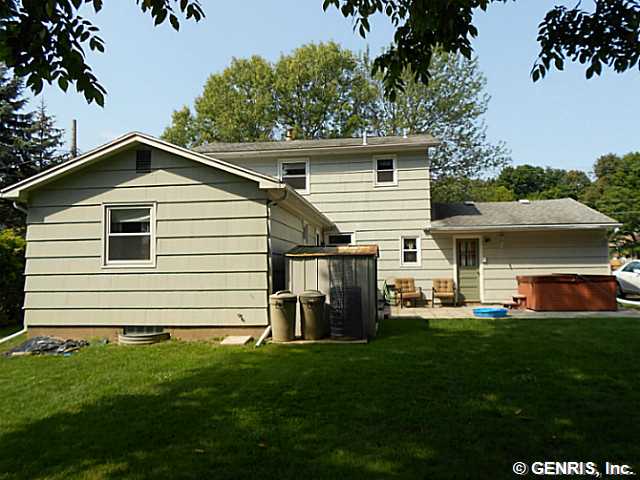 560 Helendale Road Irondequoit, NY 14609 - Photo 18 of 19 Backyard. The back yard has a deck and patio, as w
