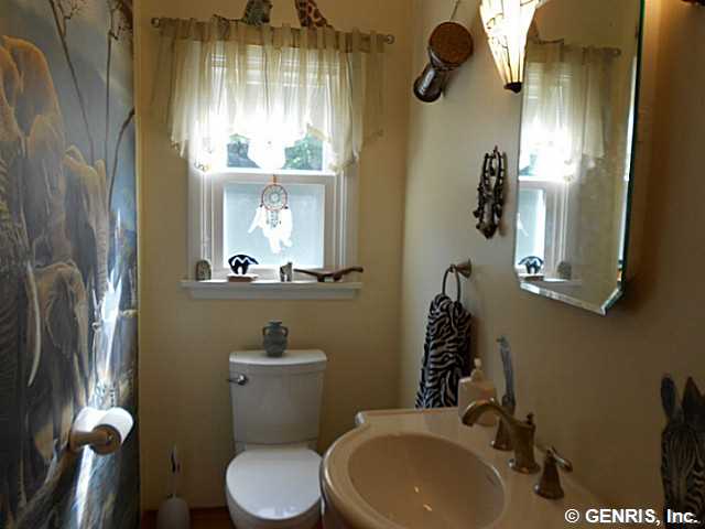 560 Helendale Road Irondequoit, NY 14609 - Photo 8 of 19 Bathroom. The powder room has a jungle motif. It s