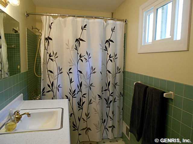 560 Helendale Road Irondequoit, NY 14609 - Photo 10 of 19 Bathroom. The tiled master bath has a full tub.